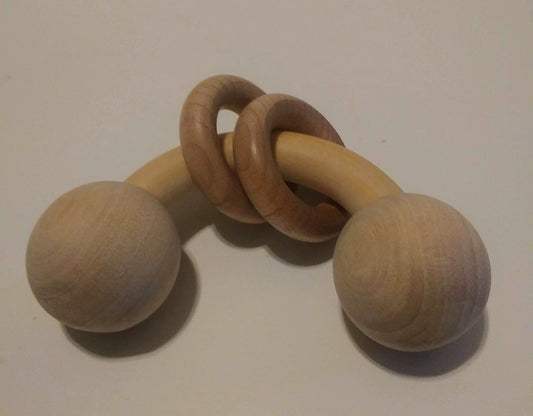 Curved baby rattle